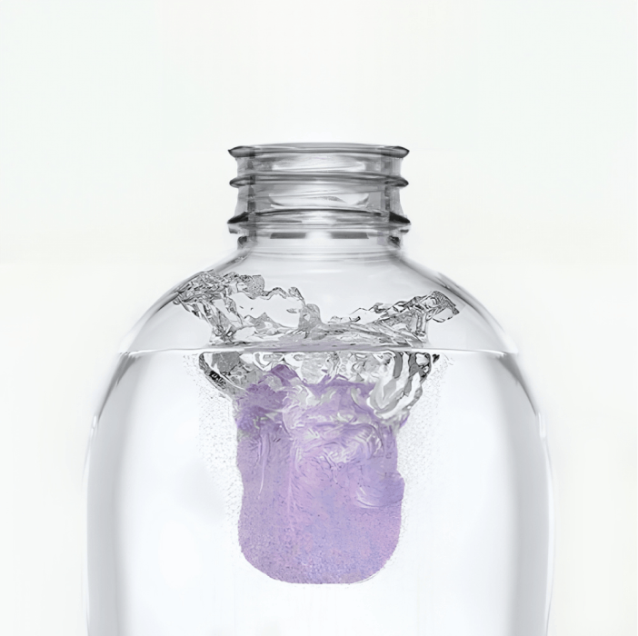 Tablet dissolving in a water-filled bottle